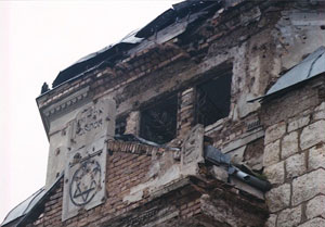 Sarajevo Synagogue with many bullet holes and bomb damage, photo by author.